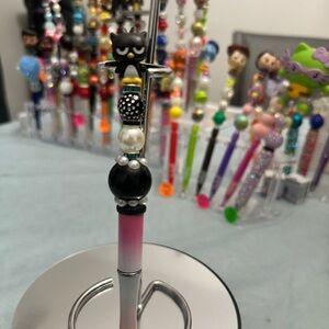 Black and Pink Character Pen